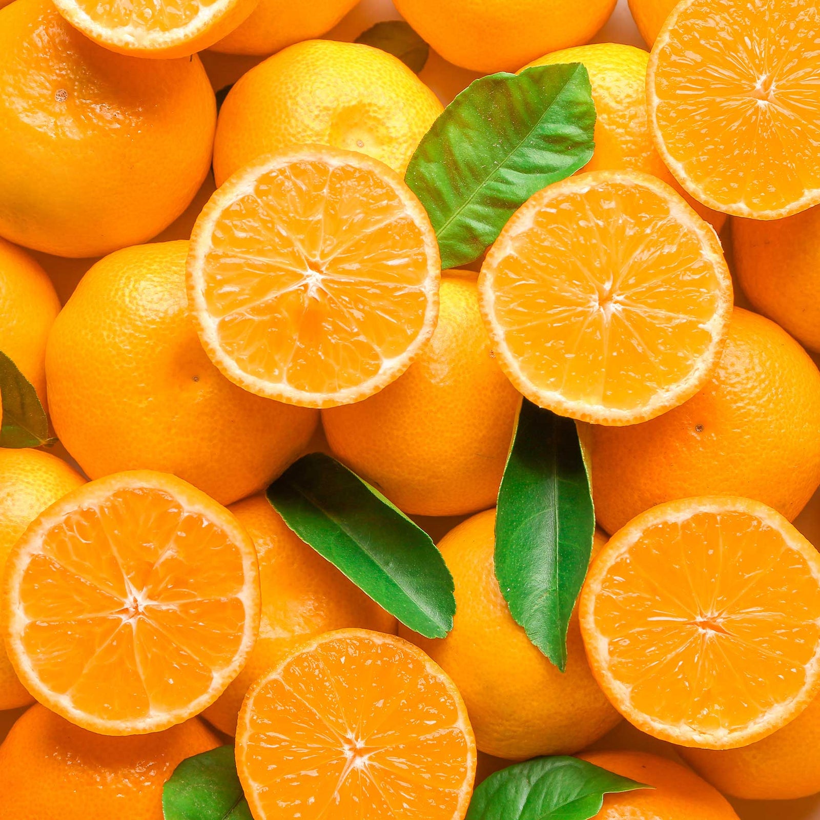 sliced and whole clementine fruit with leaves; https://cdn.shopify.com/videos/c/o/v/b994267b32684041bc13e58962464de9.mp4