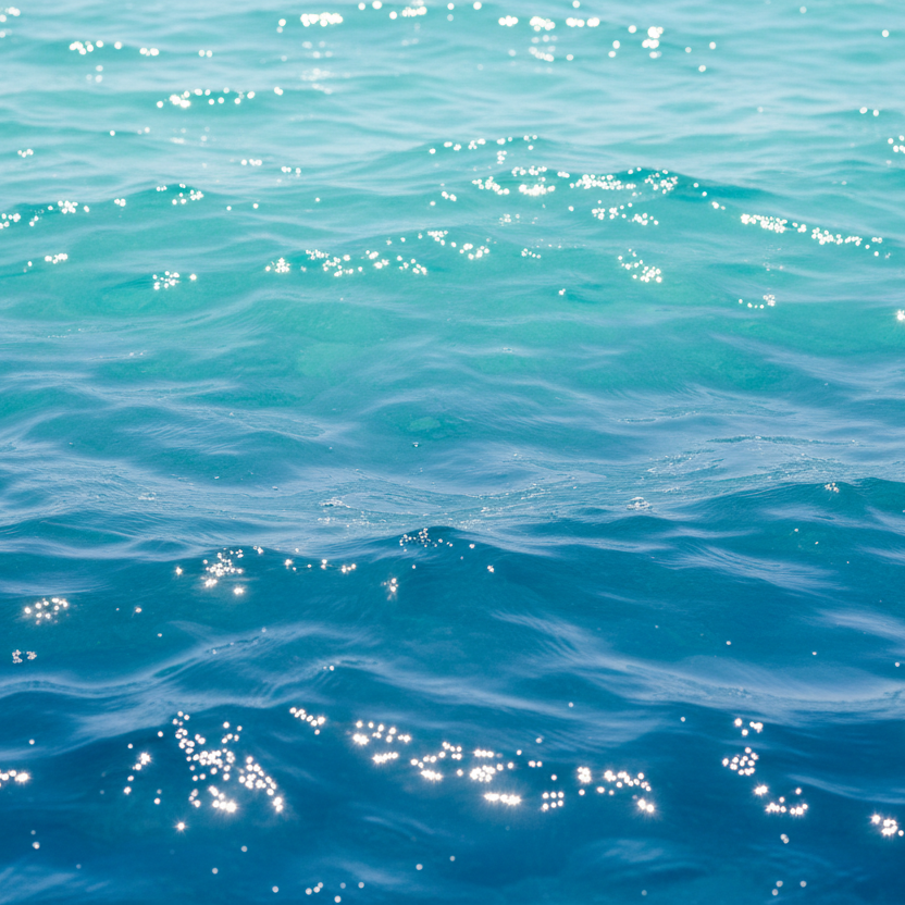 Close-up of blue water with sunlight reflections