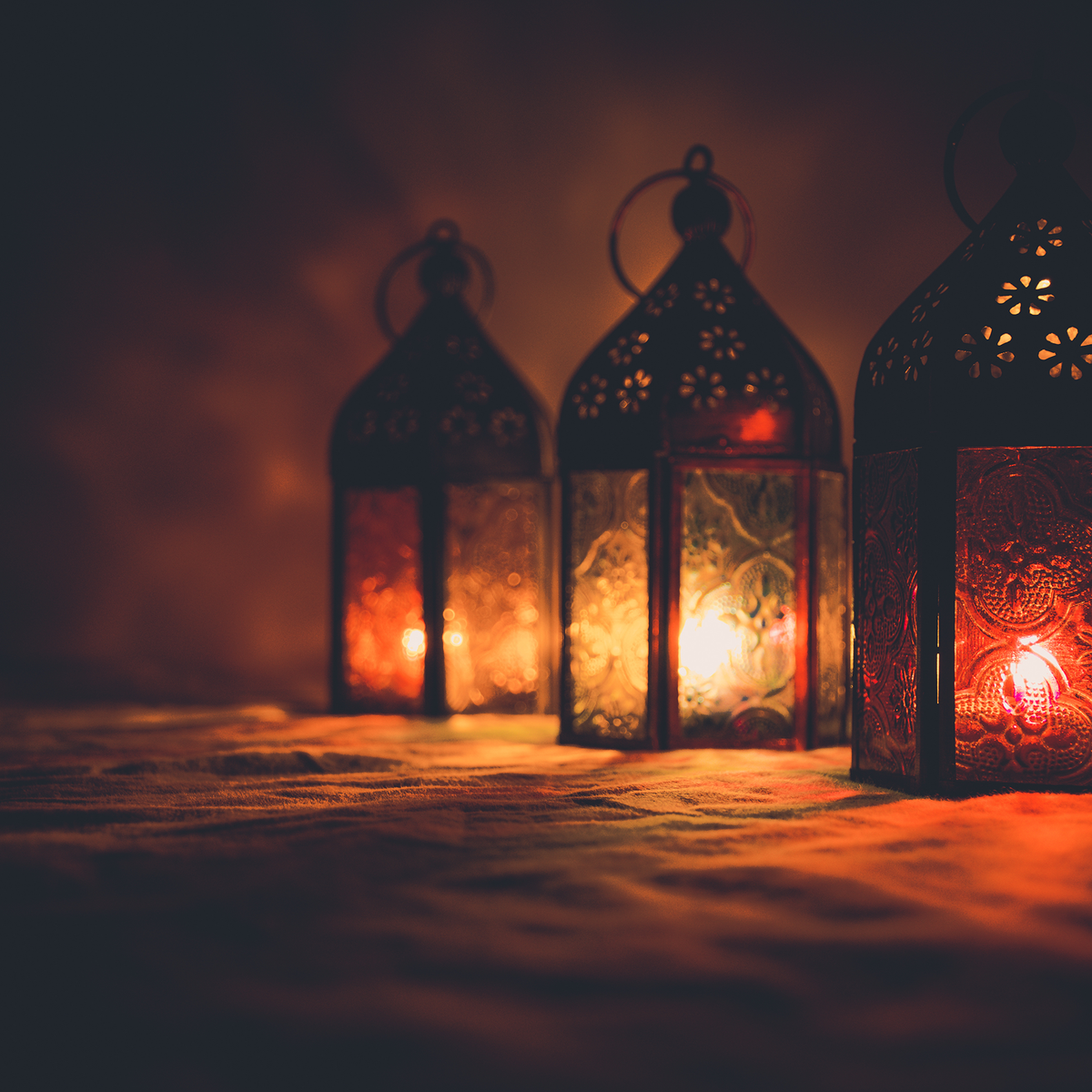 colorful candle lanterns lit at night; https://cdn.shopify.com/videos/c/o/v/9495f354639e4a4eac9fa8c747df0db6.mp4